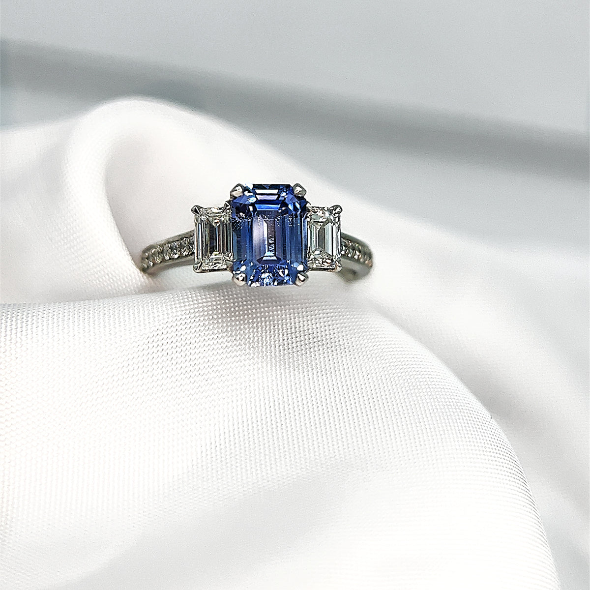 Emerald Cut Sapphire and Diamond Three Stone – Fifth Avenue Diamond Experts